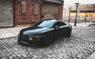 Black car brick street cityscape - shutter free wallpaper