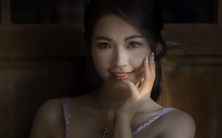 Woman necklace portrait blackhair browneyes - her cheek free wallpaper