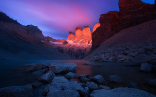 Mountain lake rocks sunset mystical - the foreground and a sunset in the background free wallpaper