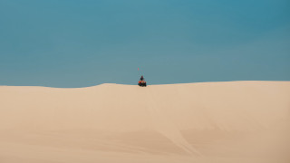 Desert quad rider blue sky - a clear day free wallpaper