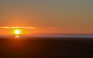 Sunset plane beach surfboard mountain - the beach in the distance free wallpaper