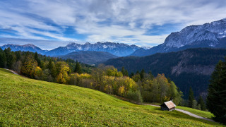 Grassy hill cabin mountains clouds - a small cabin free wallpaper