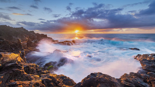 Sunset rocky beach waves ocean - a sunset over a rocky beach free wallpaper