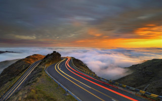 Mountain road cars sunset horizon - photography free wallpaper