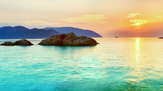 Sunset water mountains boat sky - a paddle free wallpaper