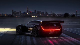 Black sports car red light 4 - a city skyline in the background free wallpaper