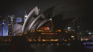 Large building city lights night 2 - anson maddock free wallpaper