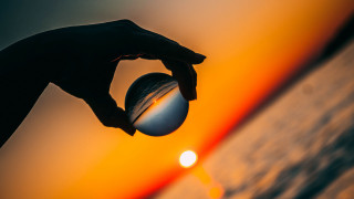 Sunset person holding ball optical - sunset time free wallpaper