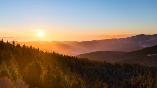 Sunset mountains forest horizon sky - a sunset over a mountain free wallpaper