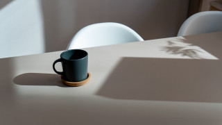 Black coffee cup white chair - top of a table next free wallpaper