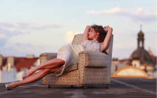 Woman sitting beach city bokeh - constanceanne parker free wallpaper