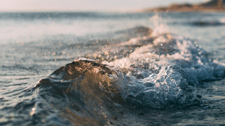Wave beach rock impressionist night - a small island in the distance free wallpaper