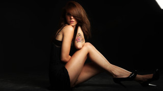 Tattooed woman sitting black dress - tattoo free wallpaper