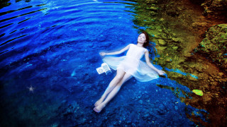 Woman floating water bag surreal - a bag free wallpaper