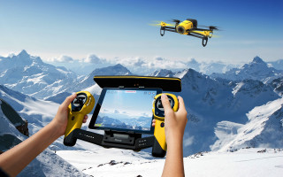 Person holding tablet remote flying - flying free wallpaper