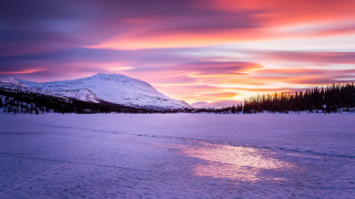 Sunset snowy mountain trail colorful - a sunset over a snowy mountain free wallpaper