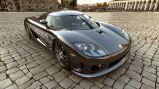 Black sports car cobblestone street 2 - unreal engine 5 free wallpaper