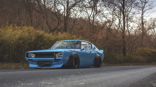 Blue car forest autumn leaves - a hill side free wallpaper