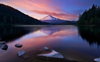 Mountain lake rocks forest sunset - a lake in front free wallpaper