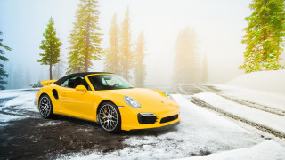Yellow sports car snowy woods - a snowy road free wallpaper