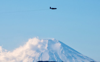 Mountain plane jet cloud sky - over a mountain free wallpaper