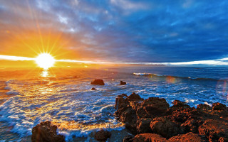 Sunset ocean rocks waves person - the rock free wallpaper