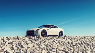 White car rocky surface tilt - a rocky surface free wallpaper