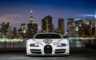 White bugatti cityscape night lights - a city skyline in the background free wallpaper