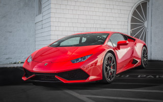 Red sports car white building - a white building free wallpaper
