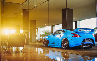 Blue sports car glass wall - reflection free wallpaper for desktop