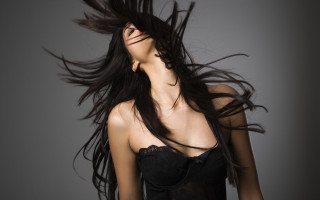Woman blowing hair black dress 2 - flowing free wallpaper
