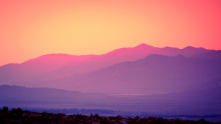 Mountain range pink sky sunset - a view of a mountain range free wallpaper