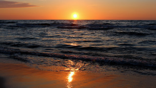 Sunset ocean waves beach person - the beach in the distance free wallpaper