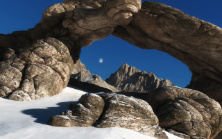 Large rock arch moon snow - the ground below free wallpaper