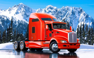 Red semi truck mountain snowy - a road near a mountain range free wallpaper