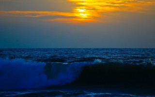 Large wave sunset ocean boat - a large wave free wallpaper for desktop