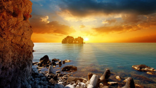 Sunset rocky beach rock formation - a rock formation free wallpaper
