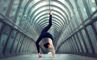 Woman handstand glass ceiling arches - symmetric free wallpaper