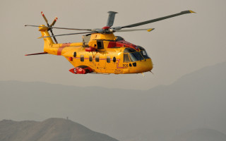 Yellow helicopter mountain range red - free airplane wallpaper