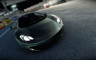 Green sports car night race - a green sports car free wallpaper