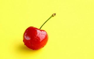 Red apple yellow background stem - a stem free wallpaper