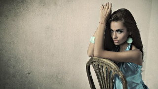 Woman blue dress leaning chair 2 - free retro wallpaper