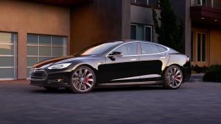 Black tesla building garage parked - a garage door open free wallpaper