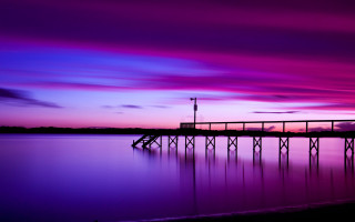 Pier lake purple sunset lighthouse - a light house in the distance free wallpaper
