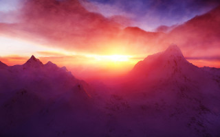 Sunset mountain range bird clouds - a sunset over a mountain range free wallpaper