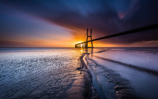 Sunset bridge water ice city - almada negreiro free wallpaper