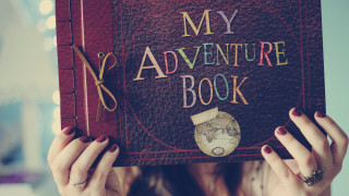 Woman holding book world map - a book free wallpaper