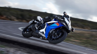 Motorcycle ride hill cloudy sky - motion blur free wallpaper