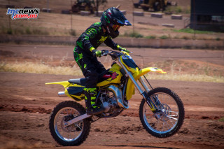 Man riding yellow dirt bike 2 - round free wallpaper