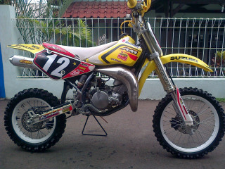 Dirt bike parked road fence - dee whitcomb free wallpaper